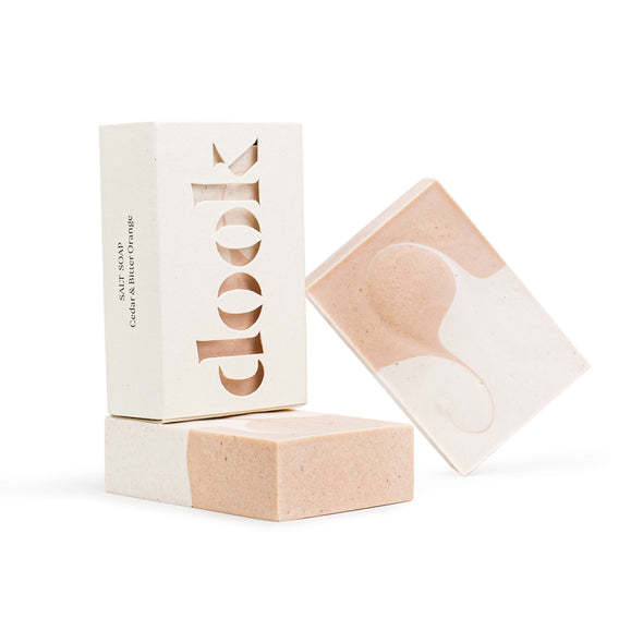 A rectangular soap encased in its cardboard packaging. The packaging has the brand name 'dook' cut out across the front.