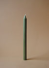 A tall green dinner candle.