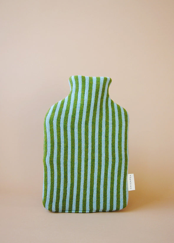 Knitted hot water bottle cover in light blue and green stripes.