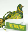 A green partridge hanging decoration made from paper board.