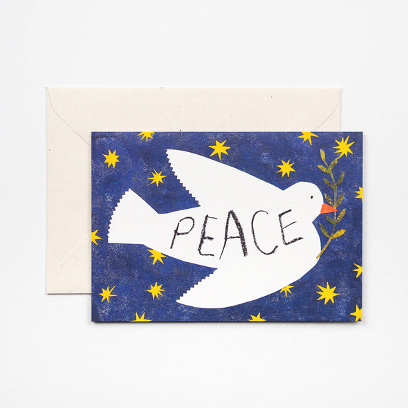 Greetings card featuring a dove against a starry deep blue sky. The dove is carrying an olive branch and has the word peace printed on its body.