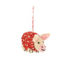 Small felted pig in a red blanket decoration on a white background