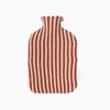 Knitted lambswool hot water bottle with vertical stripes in red and white. Height thirty four centimetres, width twenty centimetres.