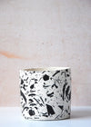 Terrazzo planter handmade by Salt Studios. Featuring a white base with black terrazzo detail. Twelve centimetres tall and twelve centimetres wide.