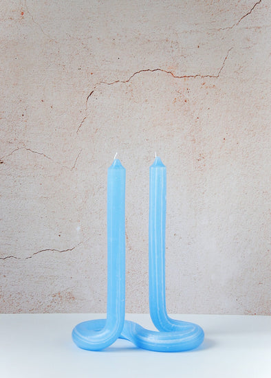 Handmade candle by Dutch designer Lex Pott. Double ended twist candle in light blue made entirely from wax and formed in such a way it stands alone on a twisted s shape base. Height twenty four centimetres, width ten centimetres, length seventeen point five centimetres.