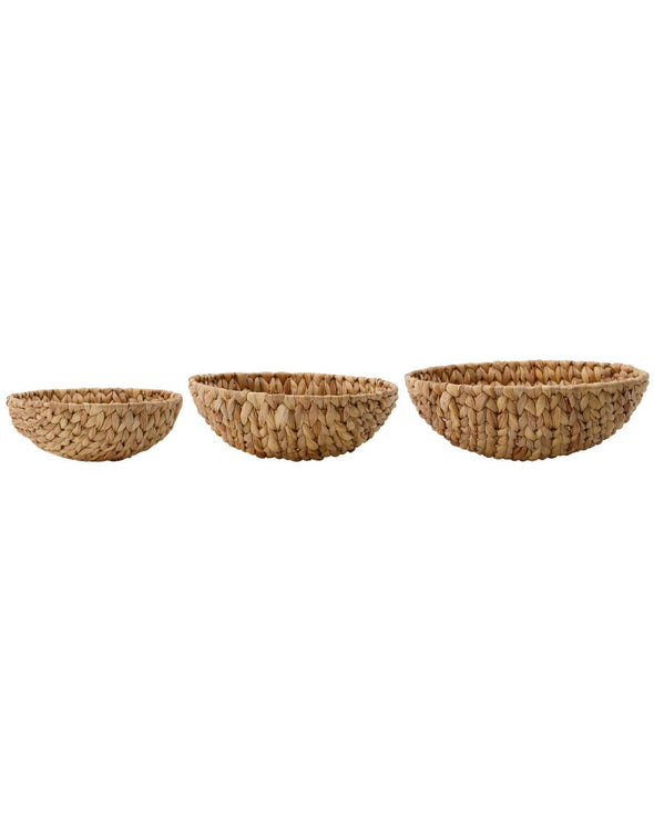 Side view of three bowl shaped baskets sitting in a row. Large, medium and small size all made from water hyacinth.