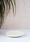 A white porcelain circular soap dish. The dish measures approximately 14cm across.