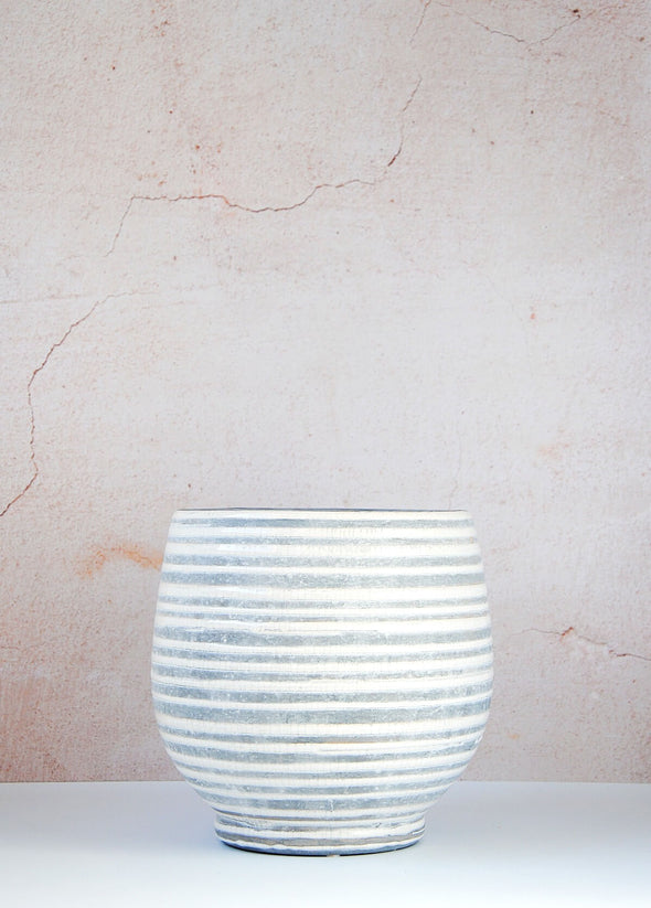 Striped stoneware planter with a grey base and white crackle glaze stripes. Height nineteen centimetres and width twenty centimetres.