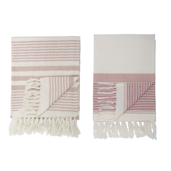 A set of two bath towels in cream with rose coloured stripes and cream tassels. Length one hundred and twenty centimetres, width eighty centimetres.