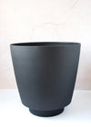 Black metal planter. It is 31cm tall and 30.5cm wide.