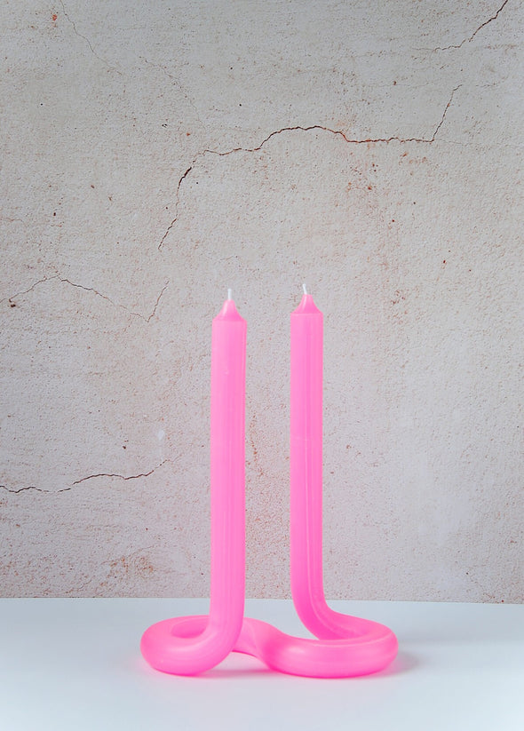 Handmade candle by Dutch designer Lex Pott. Double ended twist candle in pink made entirely from wax and formed in such a way it stands alone on a twisted s shape base. Height twenty four centimetres, width ten centimetres, length seventeen point five centimetres.