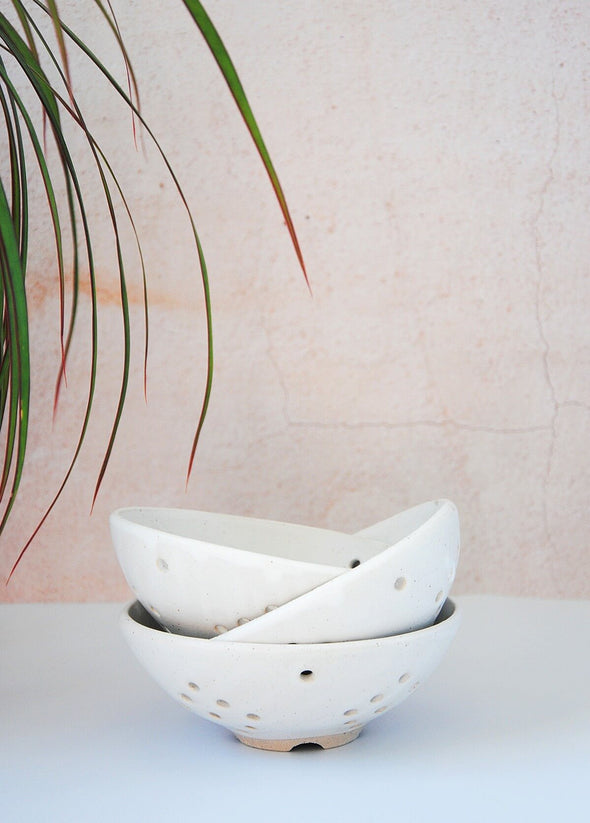 Three ceramic berry bowls stacked on top of each other. The bowls have a white glaze and are 5.5cm high and 13cm wide at the top.