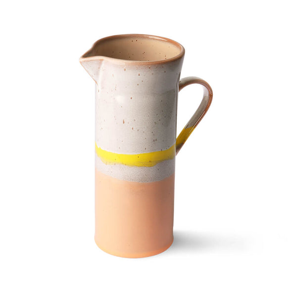 Tall ceramic jug in a layered glaze. Top half is white and bottom pink, with a yellow stripe around the middle.